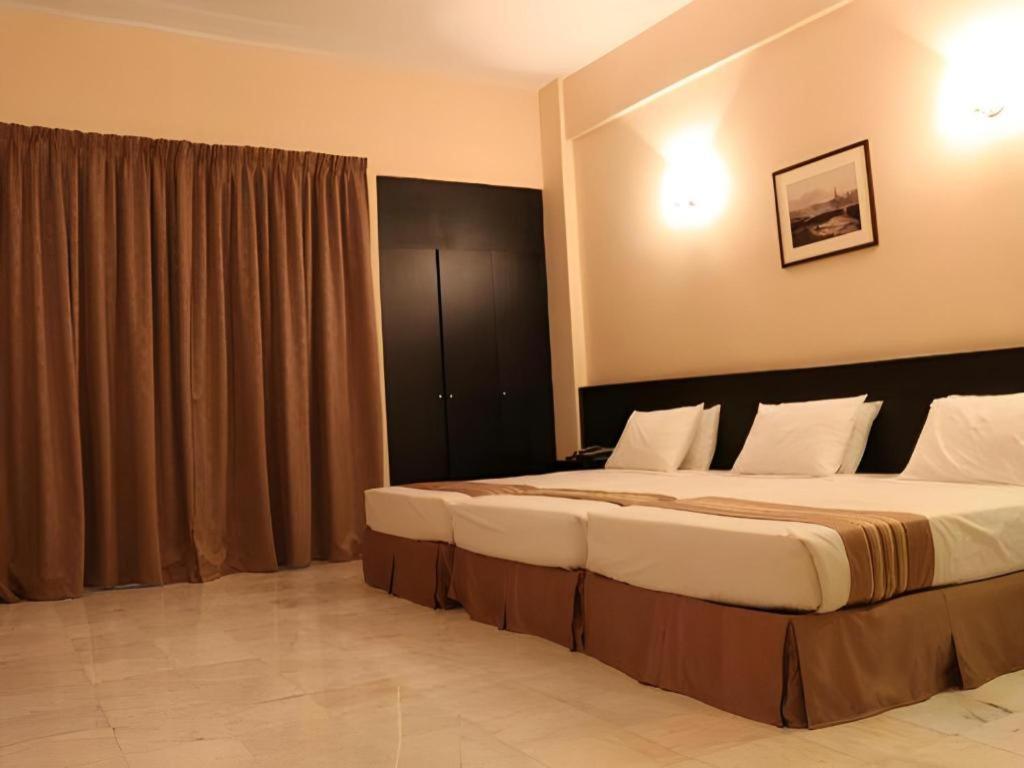 สแตลเลียน สวีท ปีนัง Hotel Jelutong ภายนอก รูปภาพ